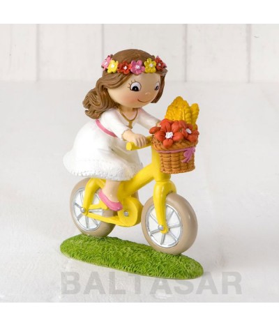 Figura pastel niña Comunión en bici 